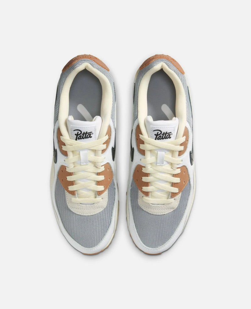 Top-down view of Patta x Nike Air Max 90 SP sneakers in particle grey and coconut milk tones.