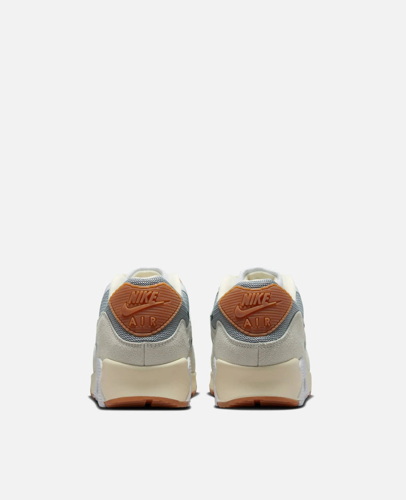 Heel view of the Patta x Nike Air Max 90 SP sneakers in Particle Grey and Coconut Milk.