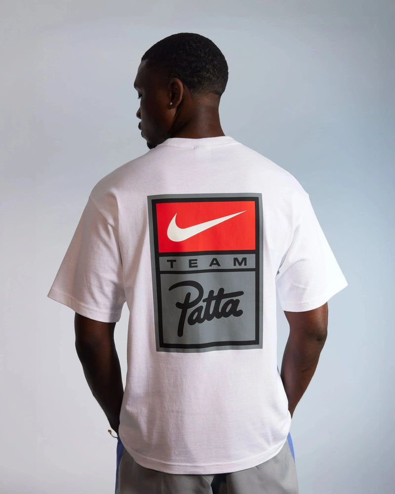 Back view of the white Patta x Nike NRG graphic T-shirt featuring a Team Patta logo badge.