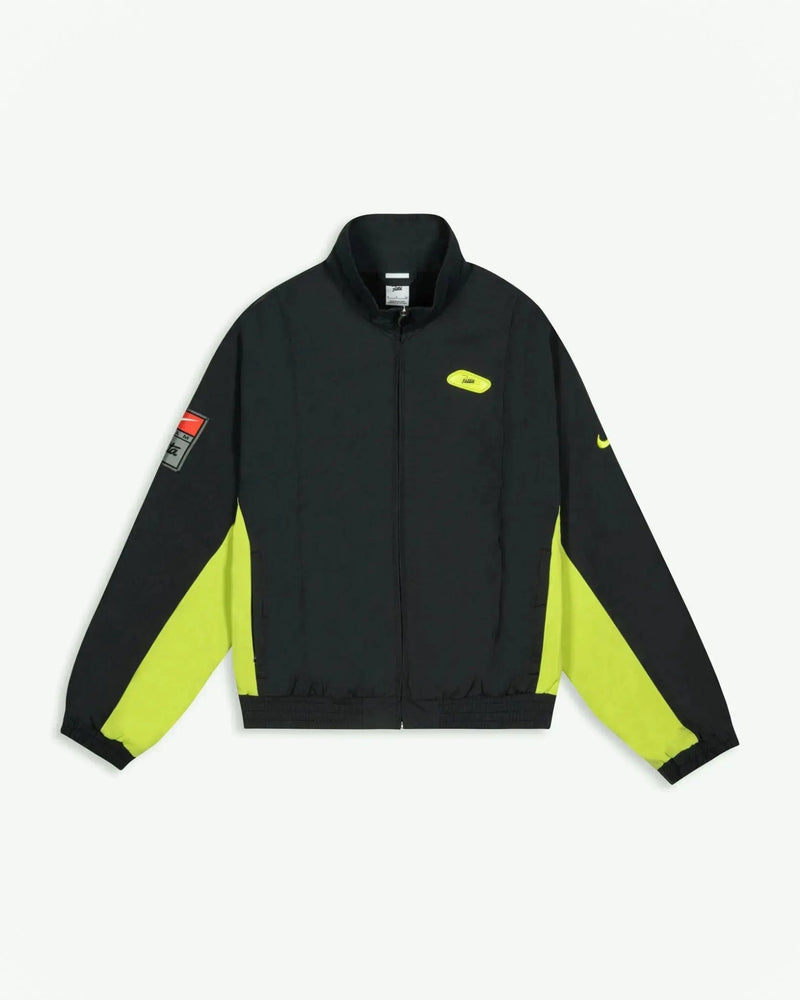 Front view of the Patta x Nike NRG Track Jacket in black with vibrant cyber yellow panelling.
