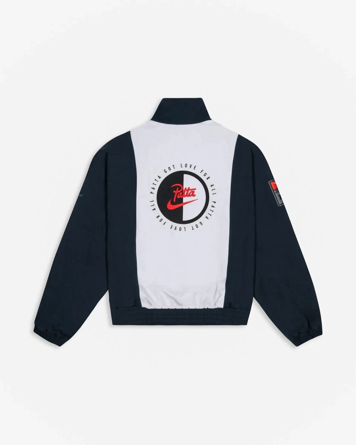 Back view of Patta x Nike NRG Track Jacket in Deep Ocean and White with circular back applique.