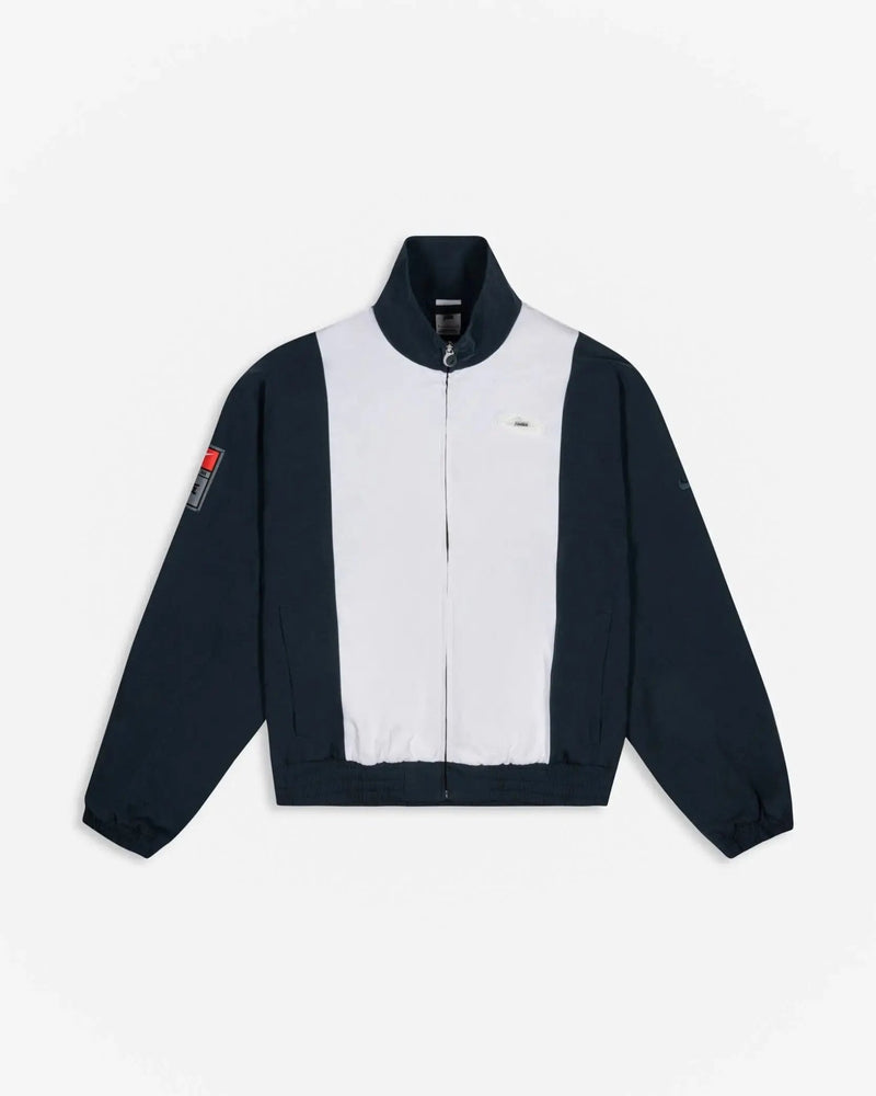 Patta x Nike NRG Track Jacket in deep ocean and white with contrast panels and full-zip front.