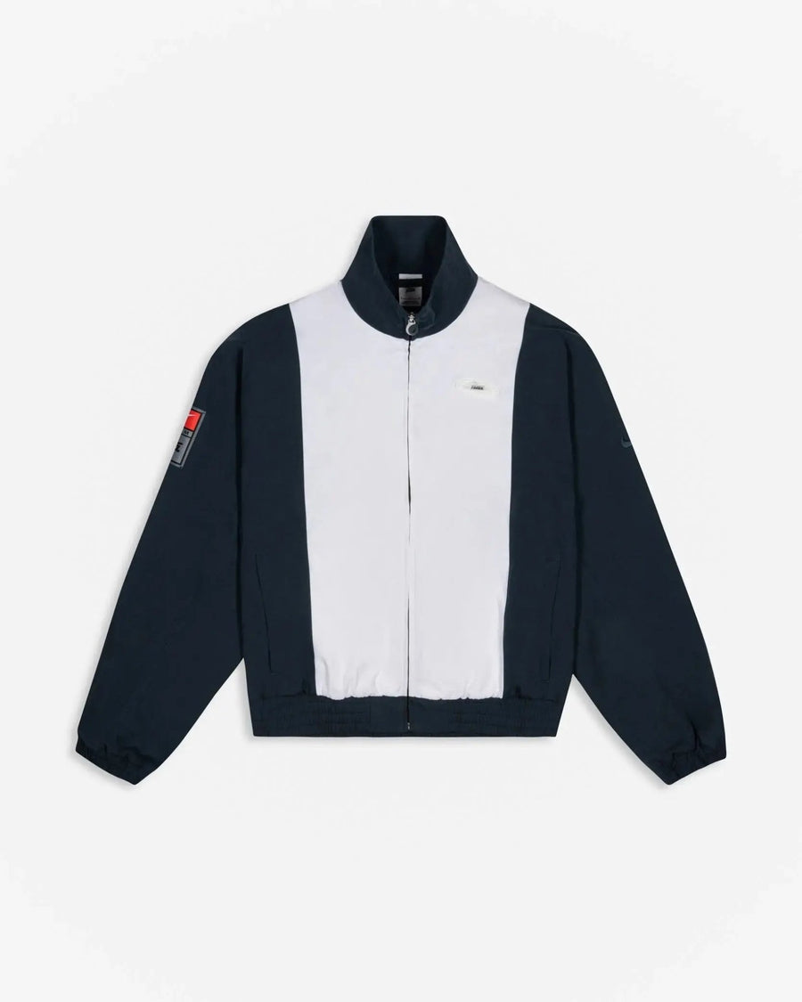 Patta x Nike NRG Track Jacket in deep ocean and white with contrast panels and full-zip front.