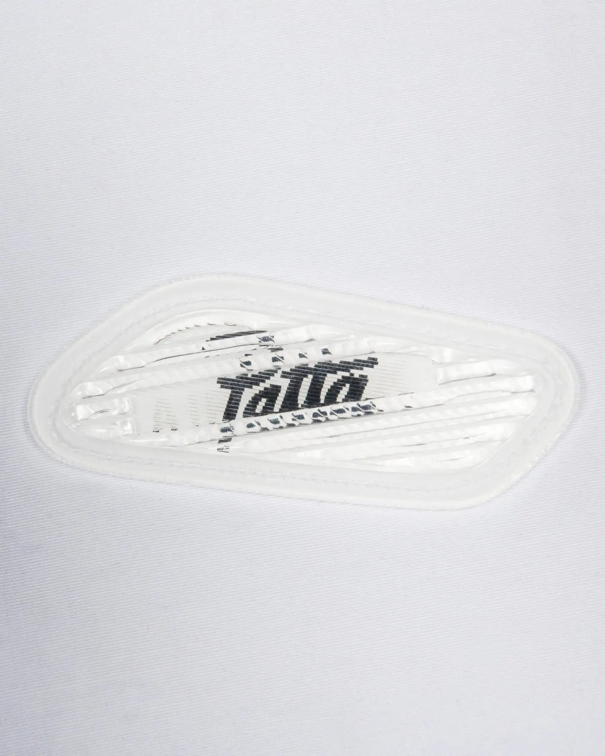 Close-up of the lenticular Air Max bubble badge on the Patta x Nike NRG Track Jacket.