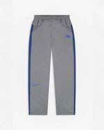 Patta x Nike NRG track pants in particle grey featuring sapphire blue side stripes and embroidered swoosh.