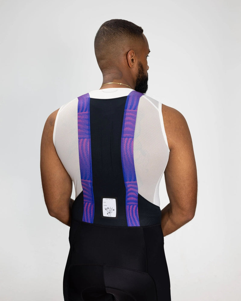 Rear view of Patta x Rapha Pro Team Bib Shorts with patterned blue and pink straps.