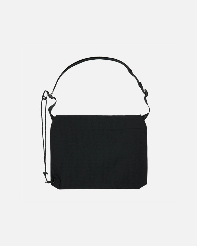 Back view of the Patta x Rapha Tech Musette nylon bag in black with adjustable strap.