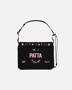 Patta x Rapha black tech musette bag with pink printed graphics and an adjustable strap.