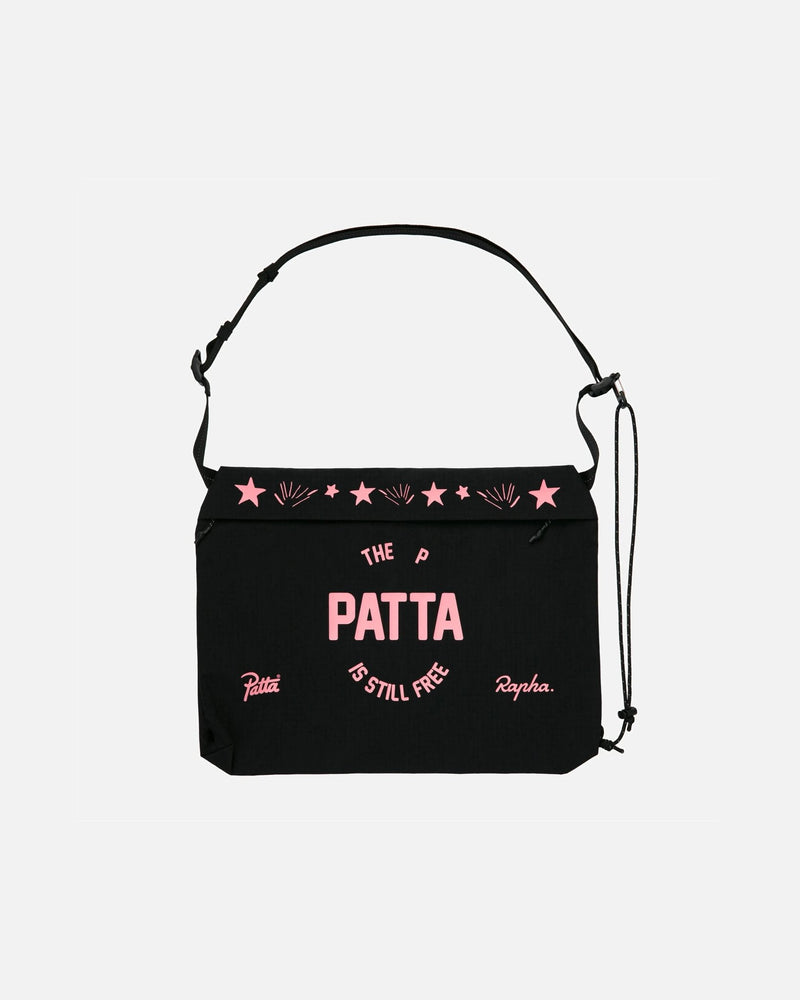 Patta x Rapha black tech musette bag with pink printed graphics and an adjustable strap.