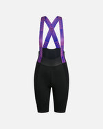 Back view of Patta x Rapha women's cycling bib shorts in black with pink and blue patterned straps.