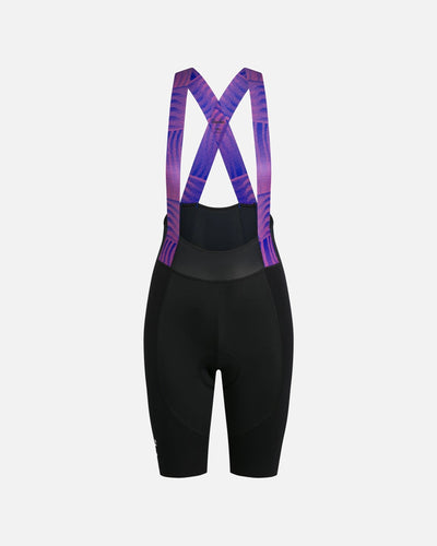 Back view of Patta x Rapha women's cycling bib shorts in black with pink and blue patterned straps.
