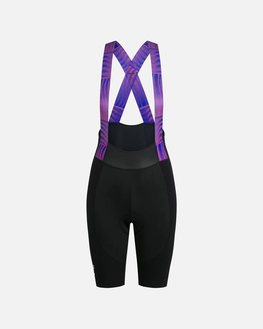Back view of Patta x Rapha women's cycling bib shorts in black with pink and blue patterned straps.
