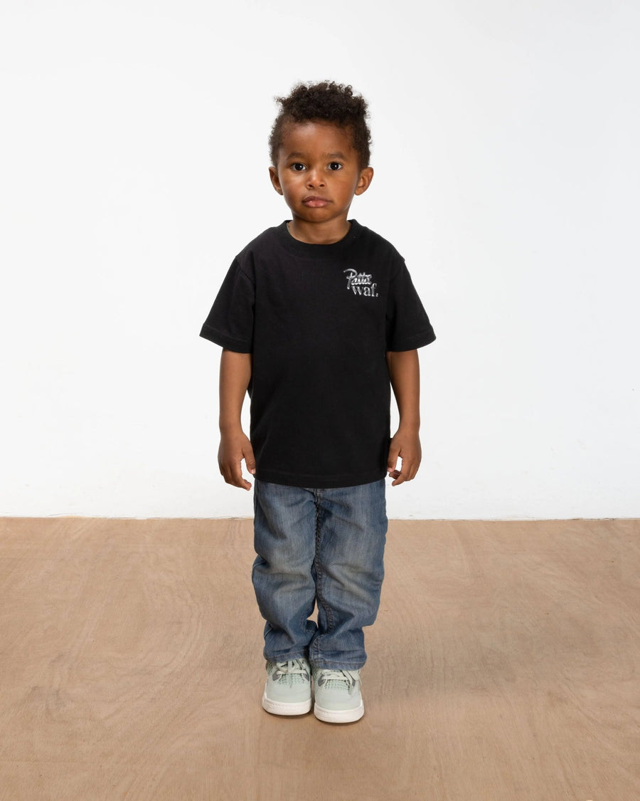 Front view of a boy wearing the black Patta x waf. Homecoming 2025 kids t-shirt.
