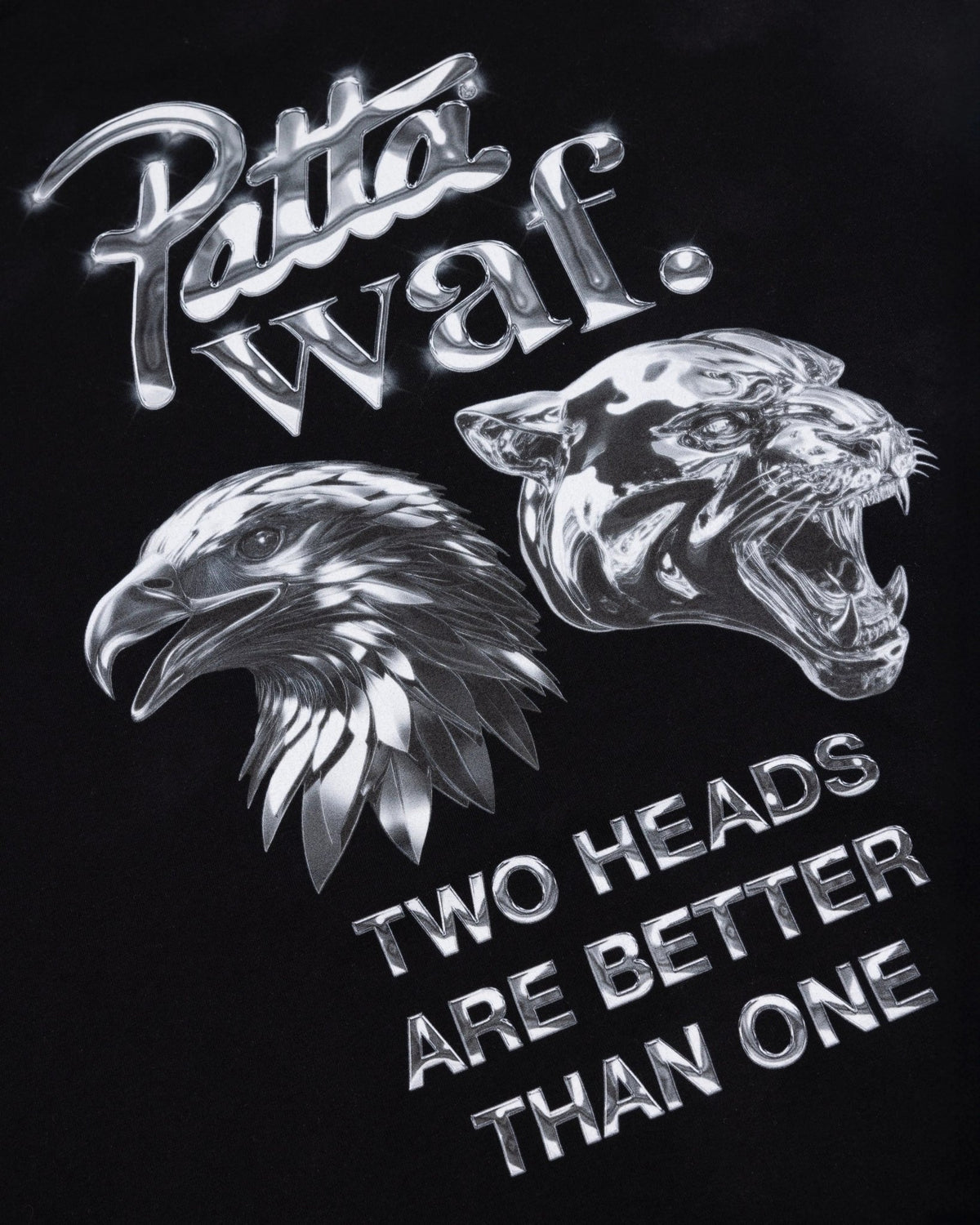 Close-up of the metallic eagle and panther graphic on the black Patta x waf. Homecoming kids t-shirt.